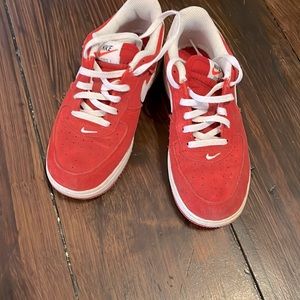 Nike size 2.5 youth. These are red leather only worn outside 1 time. LIKE NEW!